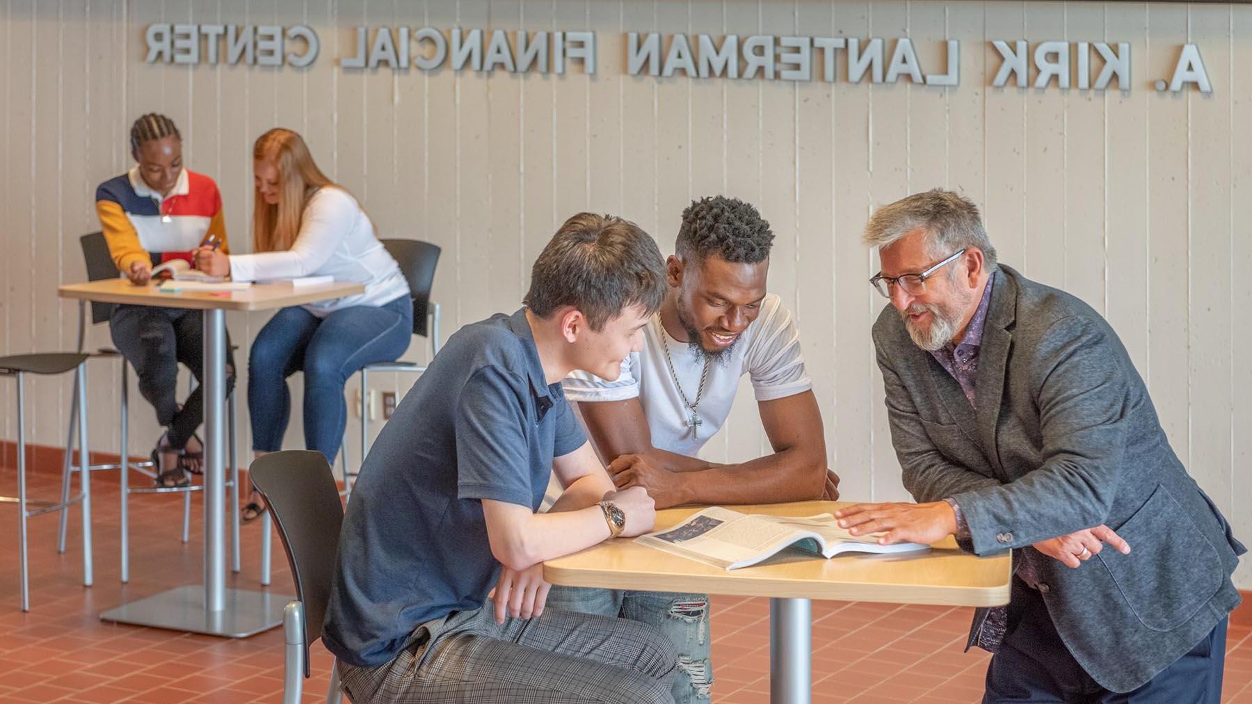 Business students meeting with Dean of the School of Business